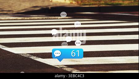Floating blue chat bubble displaying 61 on zebra crosswalk, with white and gray speech icons Stock Photo