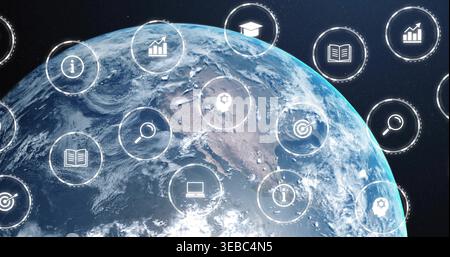 Displaying Earth rotating in orbit, with HUD icons for search, book, laptop, charts, head-gear Stock Photo