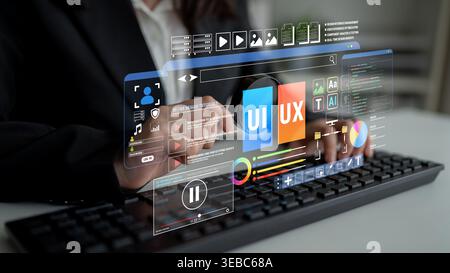 Woman in business attire using a computer with holographic UI and UX design elements displayed for digital innovation and technology concepts Fluxor. Stock Photo