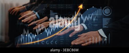 This image showcases the hands of business professionals focused on financial growth and data visualization, symbolizing success and collaboration in Stock Photo