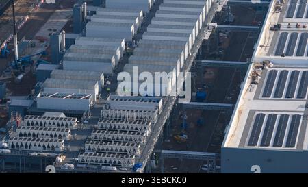 Groningen, Netherlands - 20 January 2026: Aerial view of Datacenter Westpoort featuring rows of cooling systems, modular structures, and solar panels Stock Photo