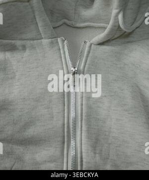 Light gray hoodie zipper close-up Stock Photo