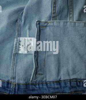 Denim inner seam with label close-up Stock Photo