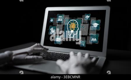 Robotic Hand Using Laptop Showcasing Artificial Intelligence Concepts in Digital Design with Light Bulb Symbol Representing Ideas and Knowledge Stock Photo