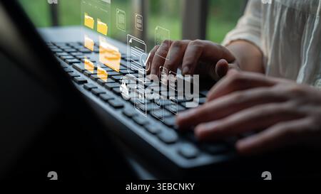 Hands Typing on Laptop Keyboard with Virtual Interface Showing Digital Files and Documents for Online Workflow and Technology Use Sigmoid Stock Photo