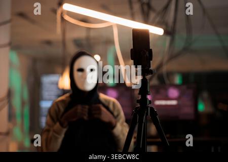 Smartphone recording hacker asking money for ransom on internet, mobile ransomware cyberattack, anonymous threatening victim. Online scam, cybercrime fraud, malicious software Stock Photo