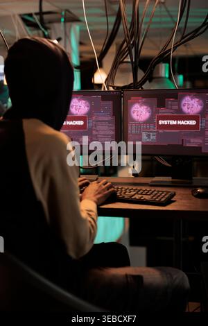 Cyberattack, system hacked warning on screen, computer security technology, information leak, hacker accessing database server. Cybersecurity, data stealing, internet virus protection Stock Photo