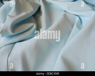 Light blue fabric folds close-up Stock Photo
