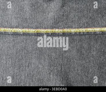 Dark denim overlock seam close-up Stock Photo