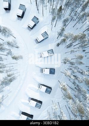 Aerial view of a modern glass high-rise building reflecting the sky and ...