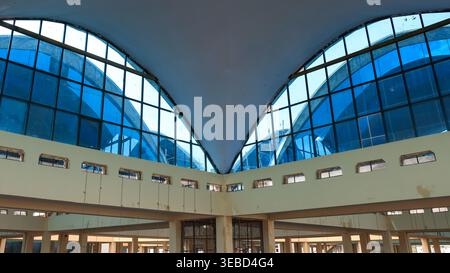 Building interior featuring a contemporary architectural design with curved glass windows on the ceiling Stock Photo