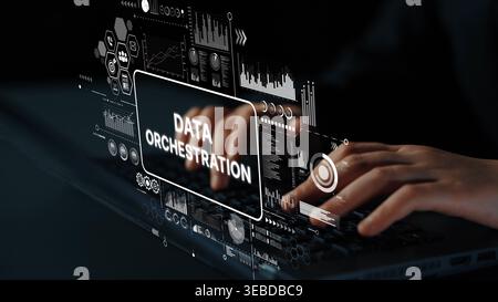 Hands Typing on Laptop with Virtual Data Orchestration Interface Displaying Graphs and Analytics in Dark Environment. Asymptotic smart data analytic. Stock Photo