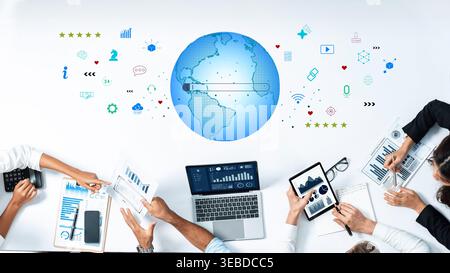 A group of professionals collaborates in a modern office setting, utilizing digital tools and data analytics to enhance business strategies and foster Stock Photo