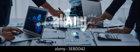 This image captures a dynamic meeting focused on artificial intelligence, featuring laptops, charts, and collaborative efforts, highlighting Stock Photo