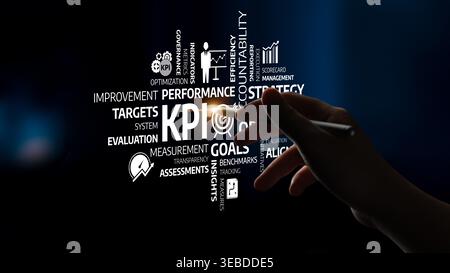 A focused hand gestures towards business strategy words highlighting key performance indicators, goals, and metrics. This visual representation Stock Photo