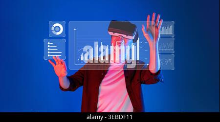 A person interacts with a transparent virtual reality interface displaying financial data analytics in a futuristic setting. Ideal for technology and Stock Photo