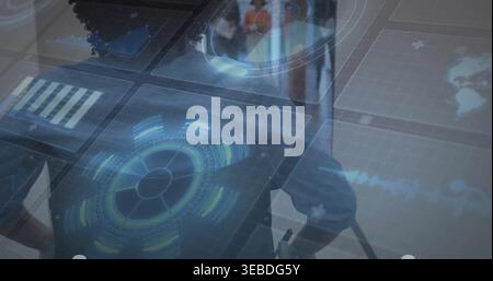 Interacting three colleagues in business shirts manipulating hologram table in office with HUD Stock Photo