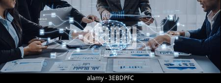 Dynamic scene of business professionals engaged in data analysis, featuring a digital brain concept, modern technology, and collaborative teamwork Stock Photo