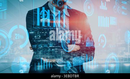 A businessman in a sleek suit stands confidently with folded arms, surrounded by digital graphs and data visualizations that symbolize growth and Stock Photo