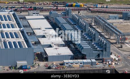 Aerial view of Datacenter Westpoort featuring industrial cooling systems and solar panels on the roof under bright daylight in Groningen, Groningen, N Stock Photo