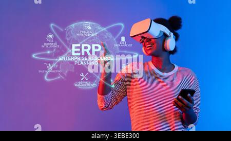 A modern analyst engages with virtual reality technology to enhance their skills in enterprise resource planning, project management, and data Stock Photo