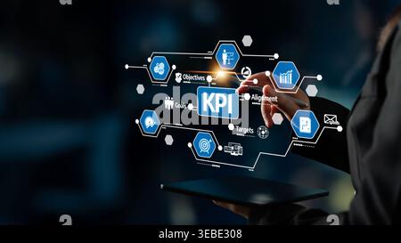 A professional engages with a digital interface showcasing KPI metrics, emphasizing goals, targets, and alignment in a modern business environment Stock Photo
