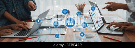 Panorama shot analyst team utilizing BI Fintech to analyze financial report with laptop. Businesspeople analyzing BI power dashboard displayed on Stock Photo