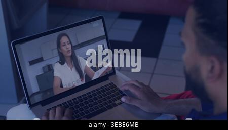 Typing man in dark-shirt red-pants watching woman in white-top holding paper on laptop at home Stock Photo