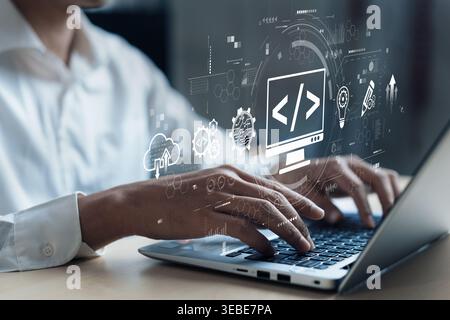 A developer engages in programming on a laptop, surrounded by visual graphics representing coding and web development concepts in a contemporary Stock Photo