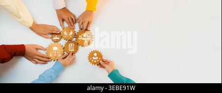 Diverse hands collaboratively holding gear-shaped icons symbolize teamwork and innovation in business solutions and strategies for effective problem Stock Photo