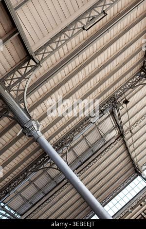 Wood-paneled ceiling of an old market hall in Paris Stock Photo