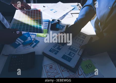 Team of Program Developer Collaborating on UXUI Design Planning in a Modern Office Environment Stock Photo