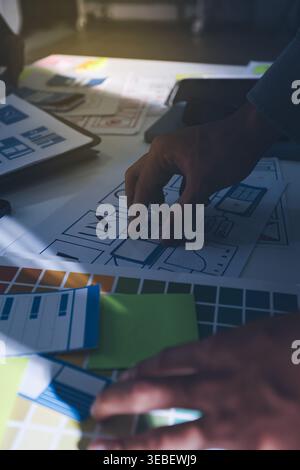 Team of Program Developer Collaborating on UXUI Design Planning in a Modern Office Environment Stock Photo