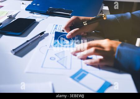 Team of Program Developer Collaborating on UXUI Design Planning in a Modern Office Environment Stock Photo