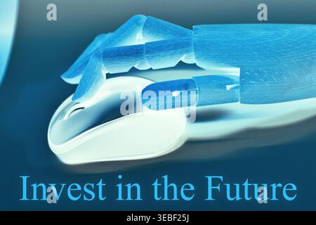 Close-up of a robotic hand using a computer mouse with the text "Invest in the future", representing technology investment, digital finance, and innov Stock Photo