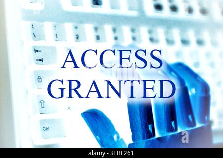 Close-up of a robotic hand with the text "Access Granted", symbolizing cybersecurity, authentication, and secure digital access. Futuristic concept re Stock Photo