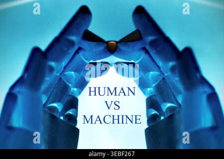Close-up of two robotic hands with the text "Human vs Machine", representing the contrast and interaction between humans and artificial intelligence. Stock Photo