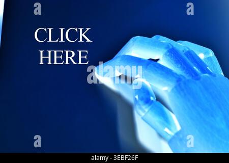Close-up of a robotic hand with the text "Click Here", representing user interaction, digital navigation, and online engagement. Futuristic concept il Stock Photo