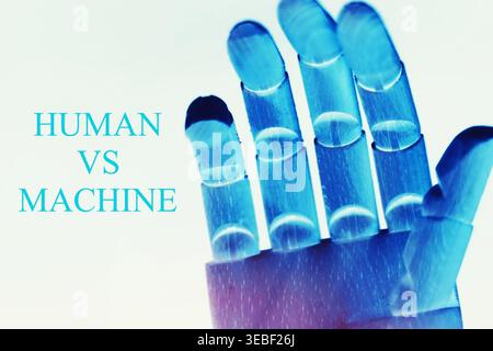 Close-up of a robotic hand with the text "Human vs Machine", representing the contrast and interaction between humans and artificial intelligence. Fut Stock Photo