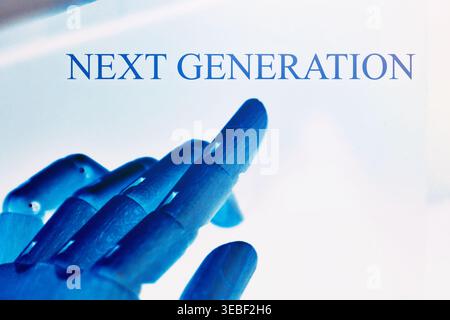 Close-up of a robotic hand pointing toward the text "Next Generation", representing future technology, innovation, and the evolution of digital system Stock Photo