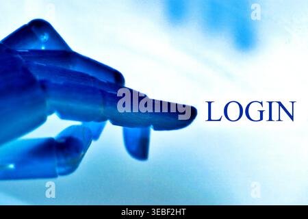 Close-up of a robotic hand pointing toward the text "Login", representing secure access, user authentication, and digital identity. Futuristic concept Stock Photo
