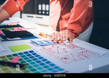 team of UI UX web designer are working together to develop mobile responsive websites with UI UX front end designer previews Stock Photo