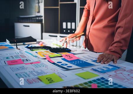 team of UI UX web designer are working together to develop mobile responsive websites with UI UX front end designer previews Stock Photo