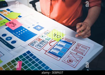 team of UI UX web designer are working together to develop mobile responsive websites with UI UX front end designer previews Stock Photo