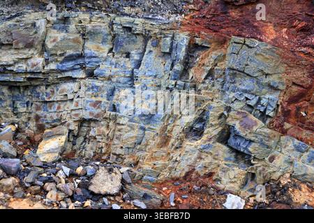 Layered rock with a rustic parts texture. Mountain pattern background. Stock Photo