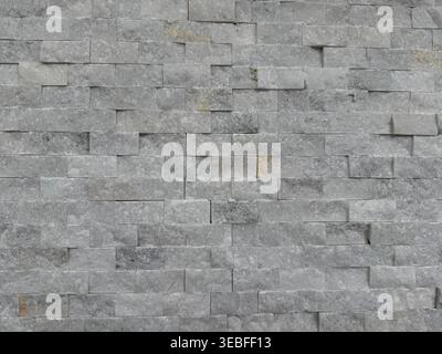 Stone brick wall texture creating rough gray background with unique pattern. Mobile photo Stock Photo