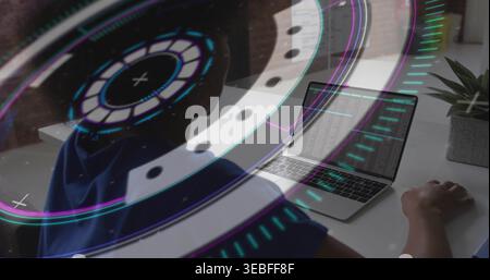 Typing coder in blue top at white desk, coding on laptop, holographic UI, succulent, copy space Stock Photo