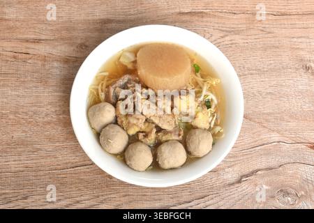 boiled meatball and braised beef meat tendon with bean sprout in clear soup on bowl Stock Photo