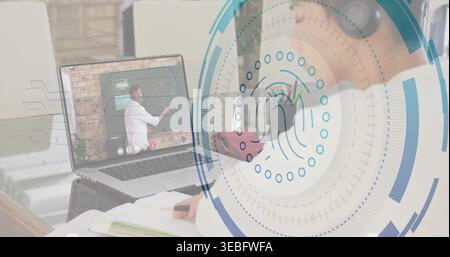Writing Korean student wearing headphones taking notes in notebook at desk, with laptop UI overlay Stock Photo