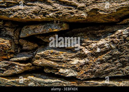 Ancient Greek slate flat stone rock wall, stacked flat stones plates stimata in Ikaria, Greece of Aegean island ancient old architecture schist Stock Photo